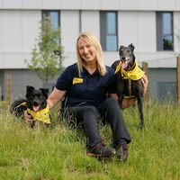 Cardiff rehoming centre manager Angela with her dog in front of the centre