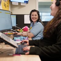 Two members of Dogs trust staff working in the iPETS call centre office