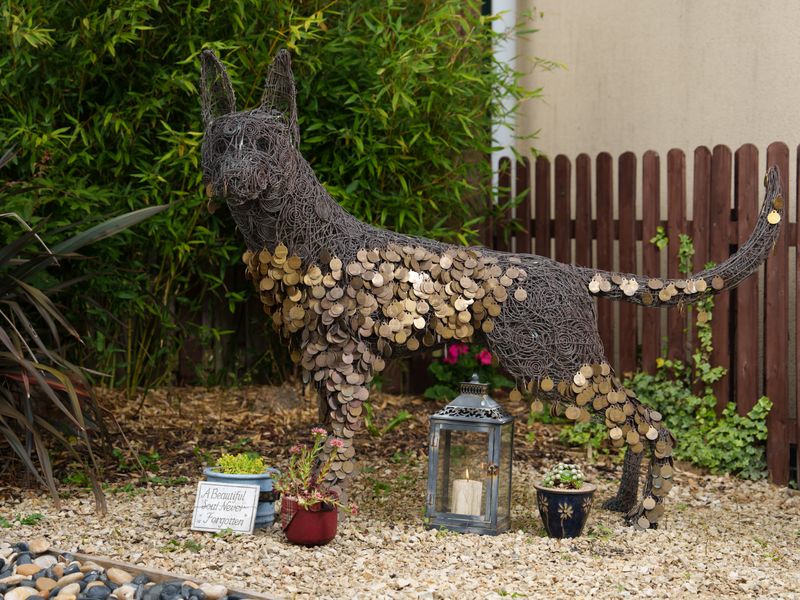 Dogs Trust Ireland dog memorial tags on dog sculpture in legacy garden